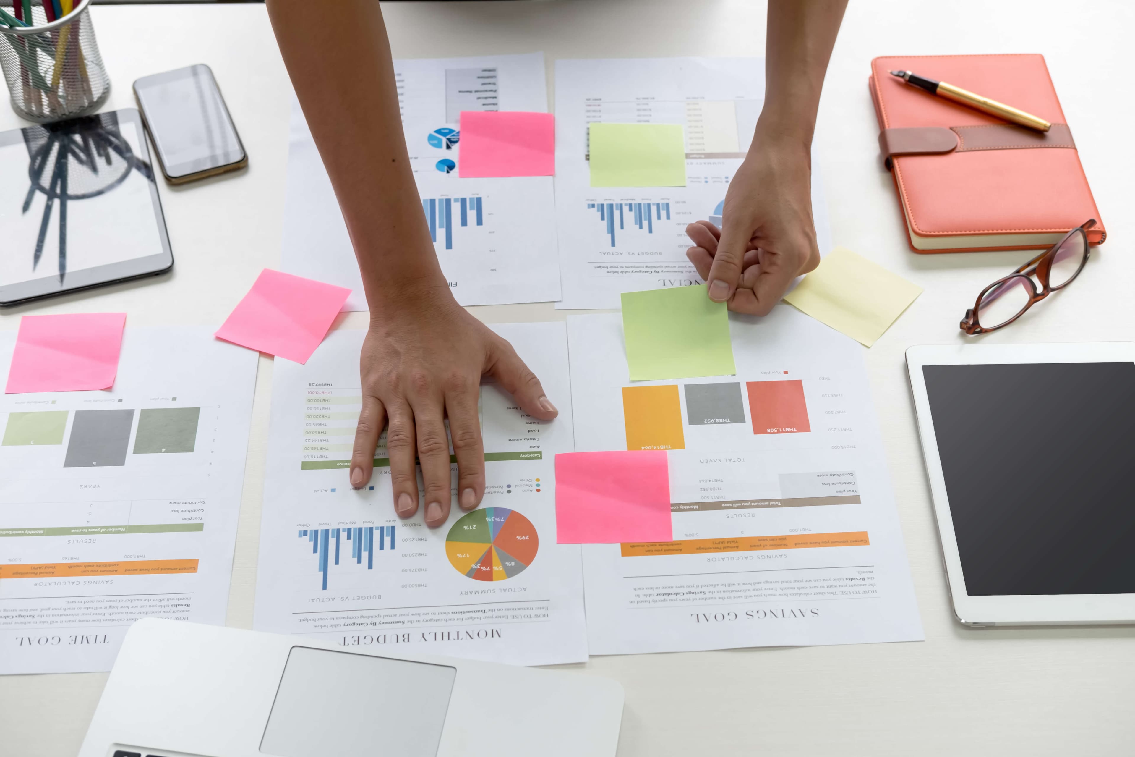 Professional workspace with planning documents and job analysis materials